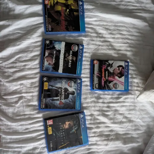 Диски для PlayStation 4: Infamous First Light, Heavy Rain + Beyond Two Souls, Uncharted, Death Stranding, Shin Megami Tensei Nocturne