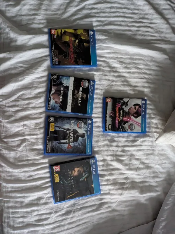 Диски для PlayStation 4: Infamous First Light, Heavy Rain + Beyond Two Souls, Uncharted, Death Stranding, Shin Megami Tensei Nocturne