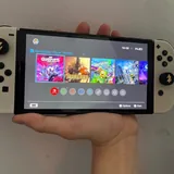 Nintendo Switch OLED, игры, док-станция, Joy-Con, чехол 1