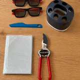 Секатор, 3D-очки, органайзер, нож, фотоальбом, карабины, приспособление для бритья 1